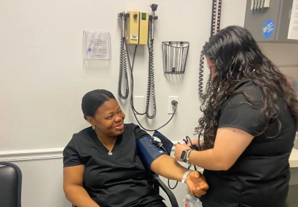 Medical assistant managing vials for blood draws