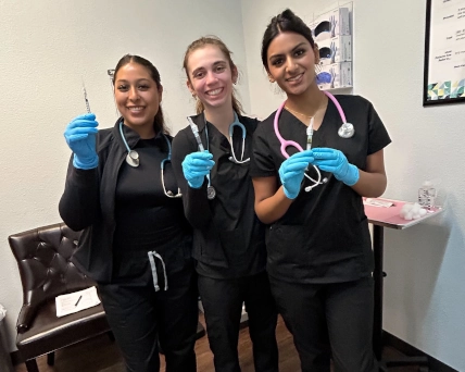 Medical assistants posing for photo between classes
